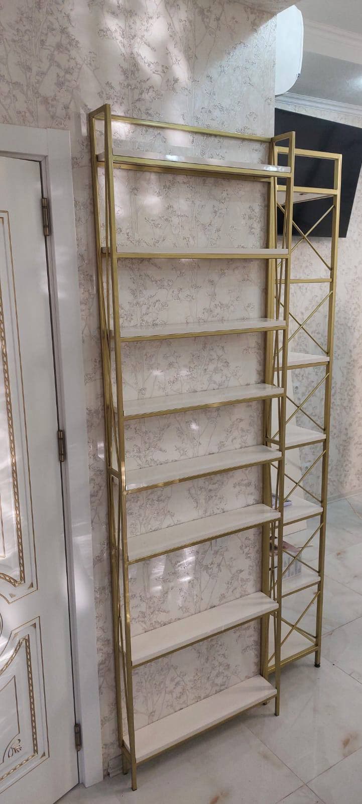Wall shelving in a warm metal finish